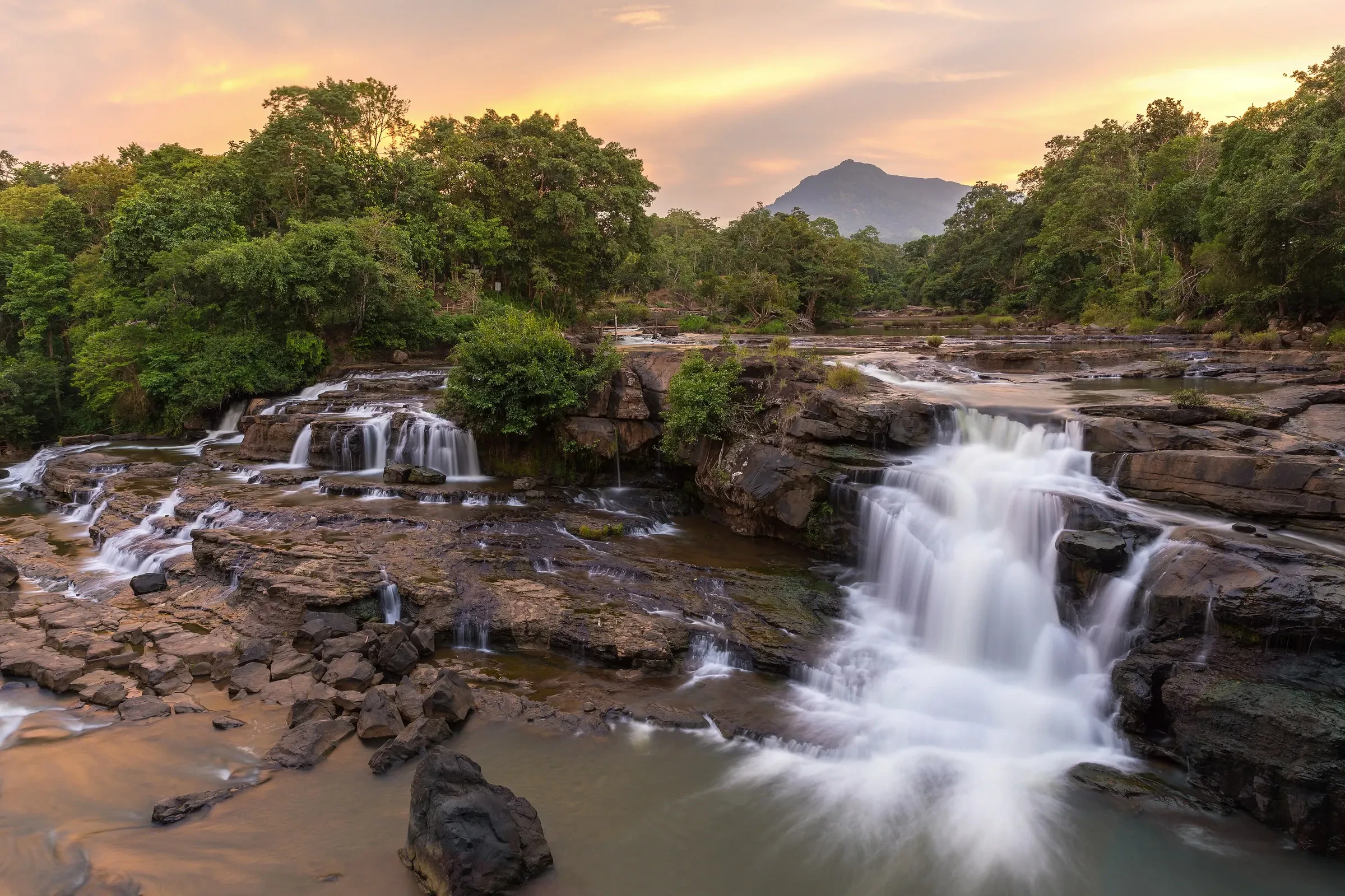 Tad Hang waterfalls at sunset in Tad Lo village on the Bolaven Plateau