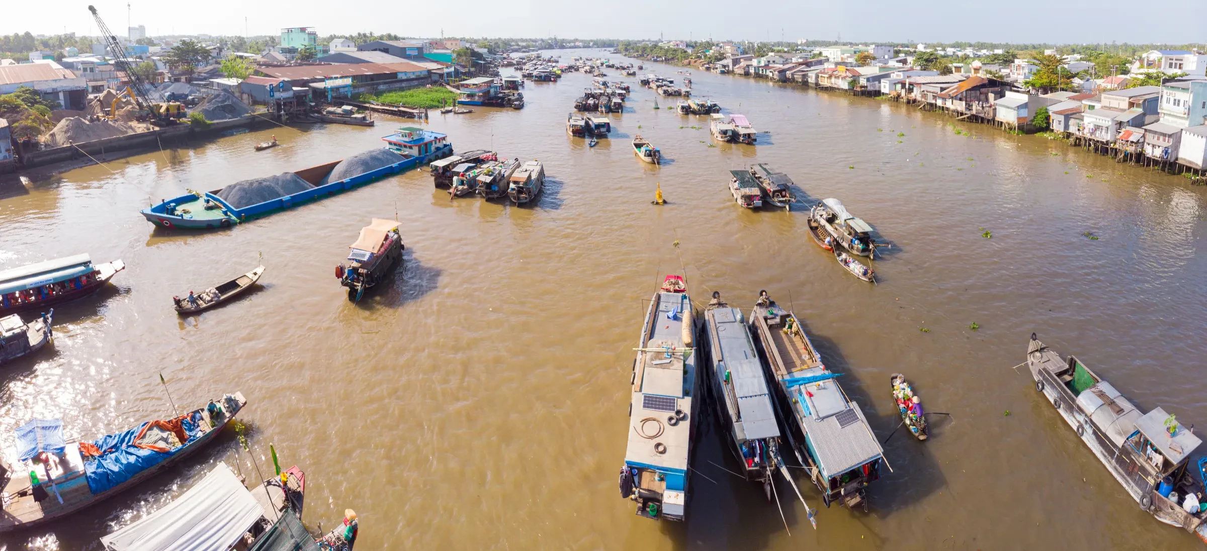 Cai Rang floating market on the Can Tho River at sunrise, seen from above