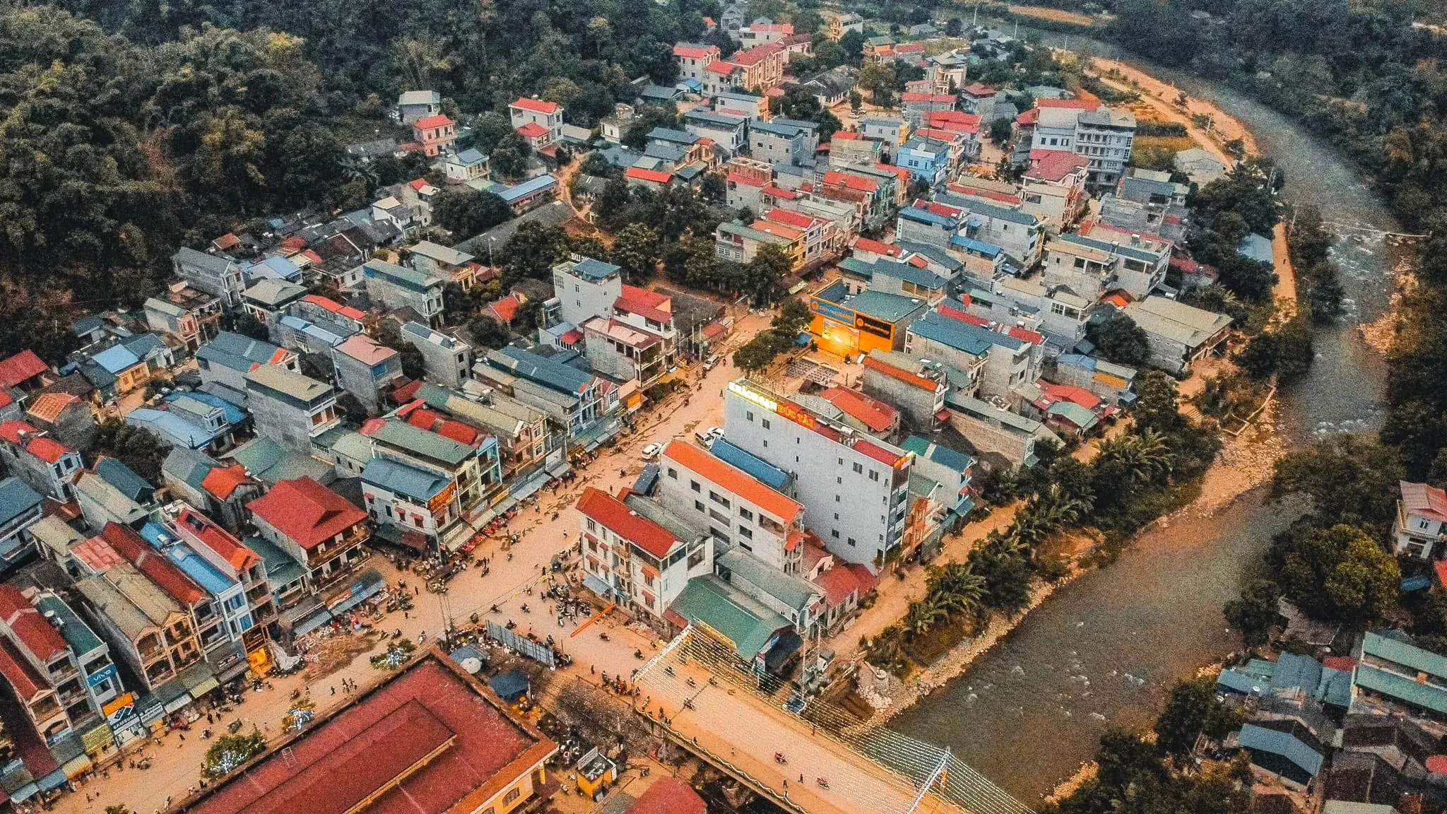 The town of Bao Lac in Cao Bang seen from above, with a river along one side