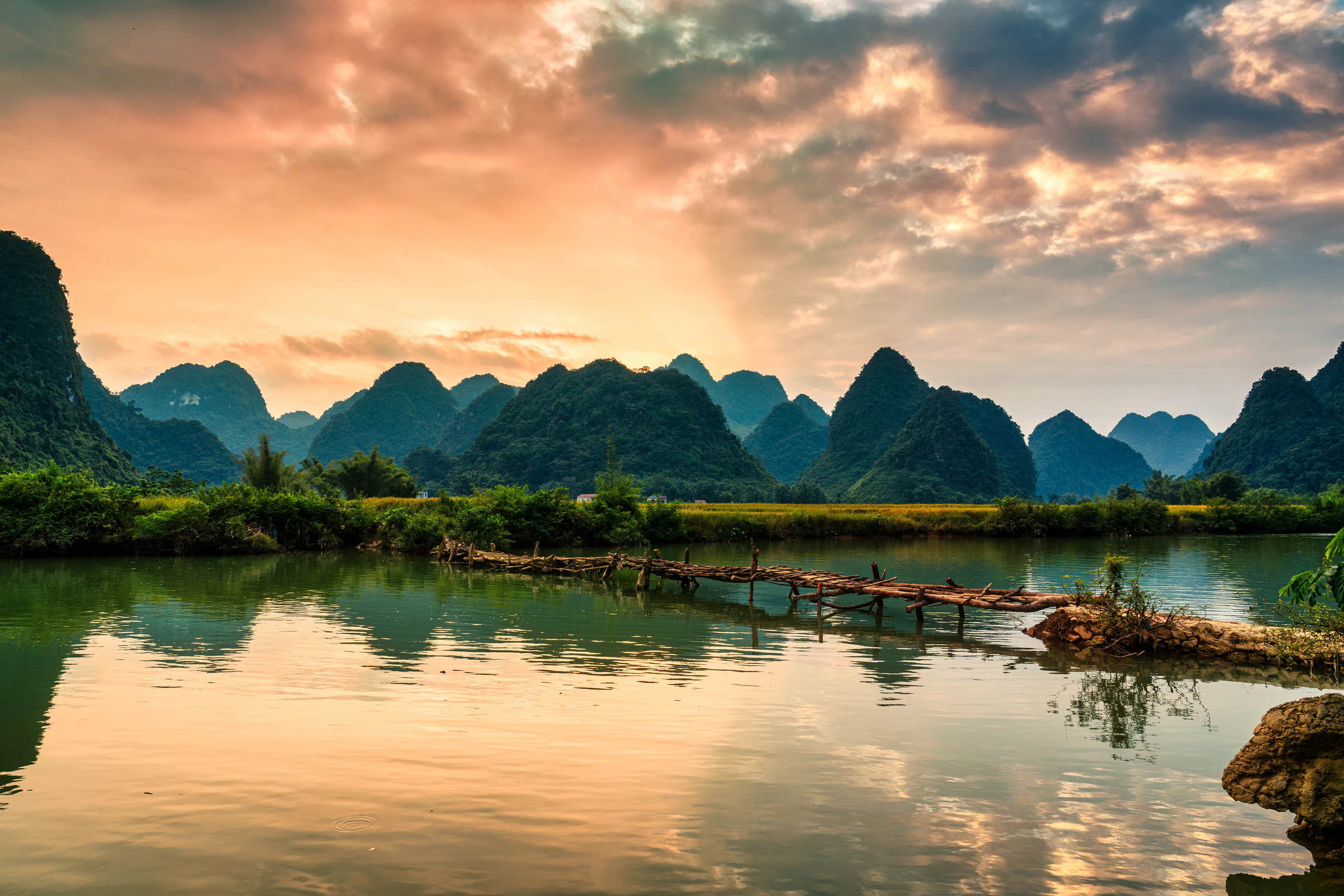 Sunset over the river and limestone hills of Phong Nam valley in Cao Bang