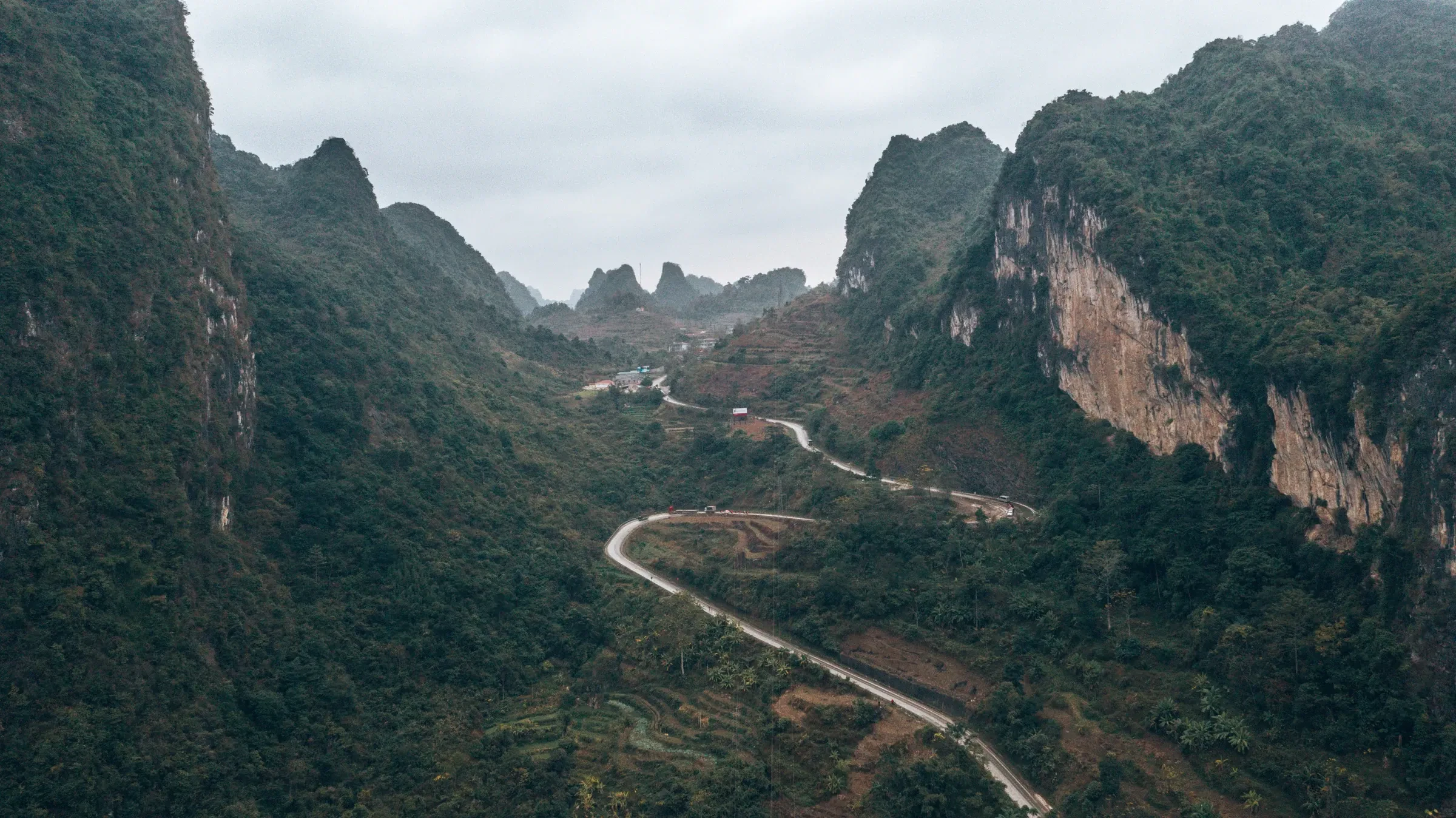 A winding road through a limestone valley in northern Vietnam