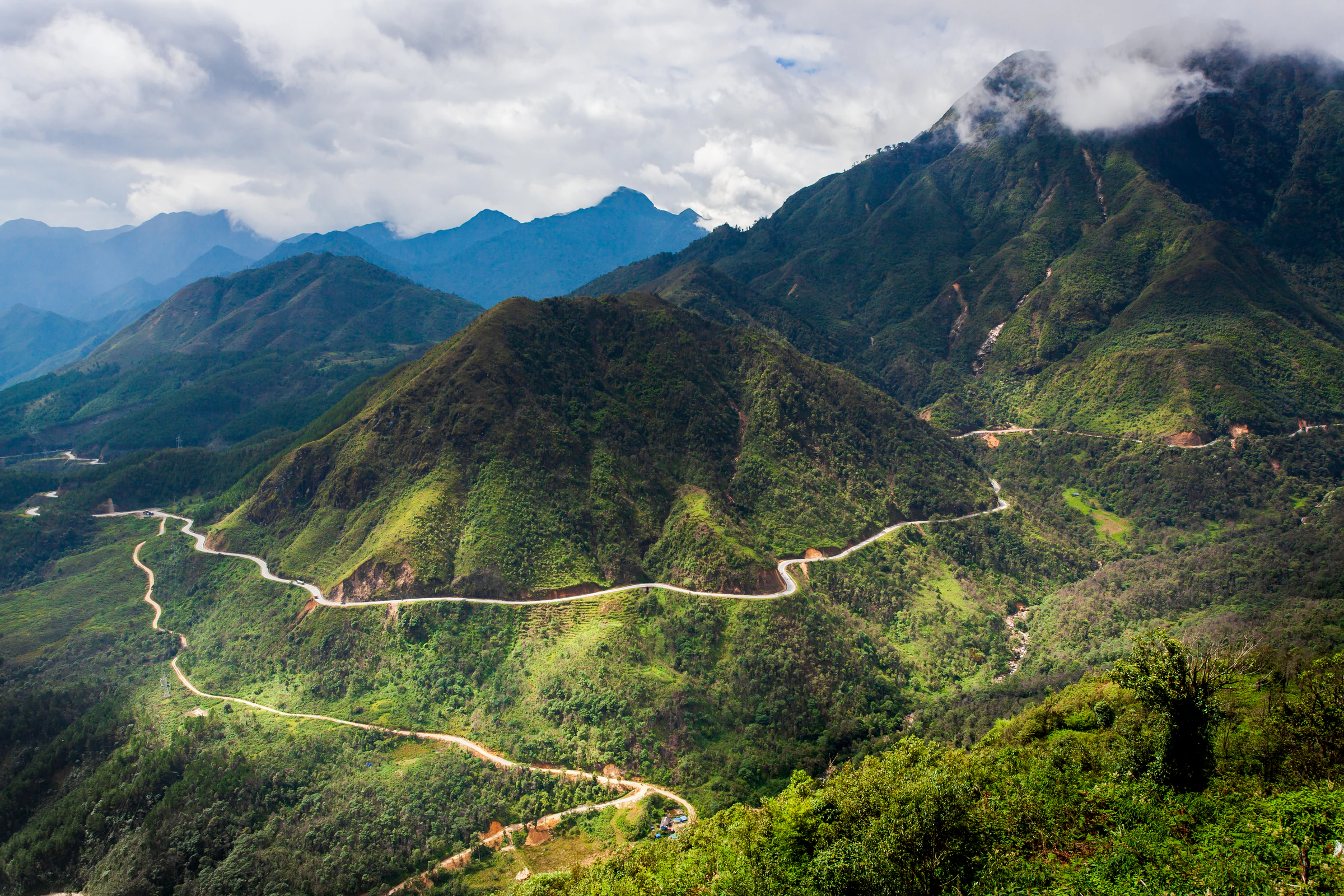 A winding road through green hills in northern Vietnam