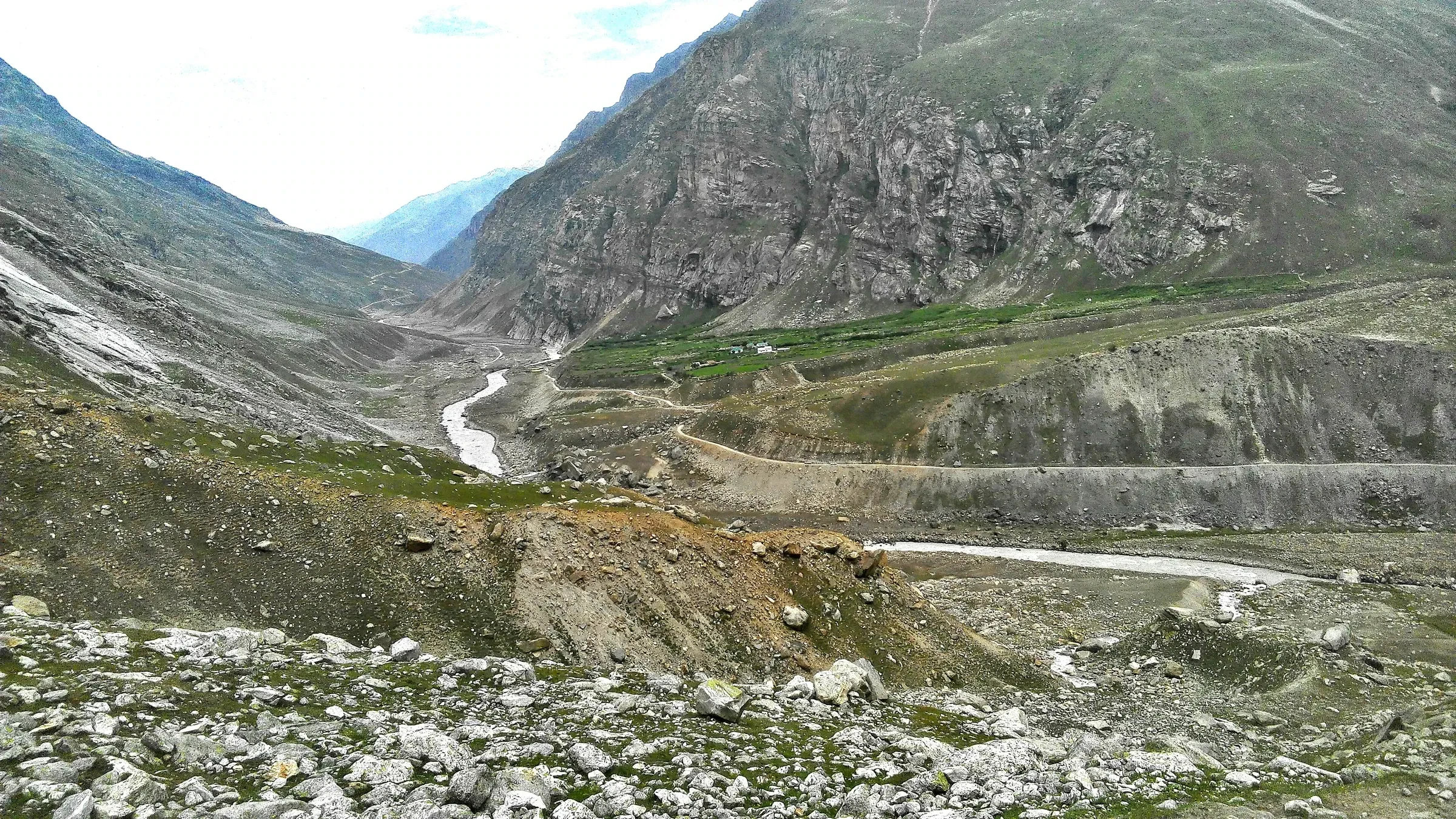 A river winding down a wide rocky valley towards Chhatru