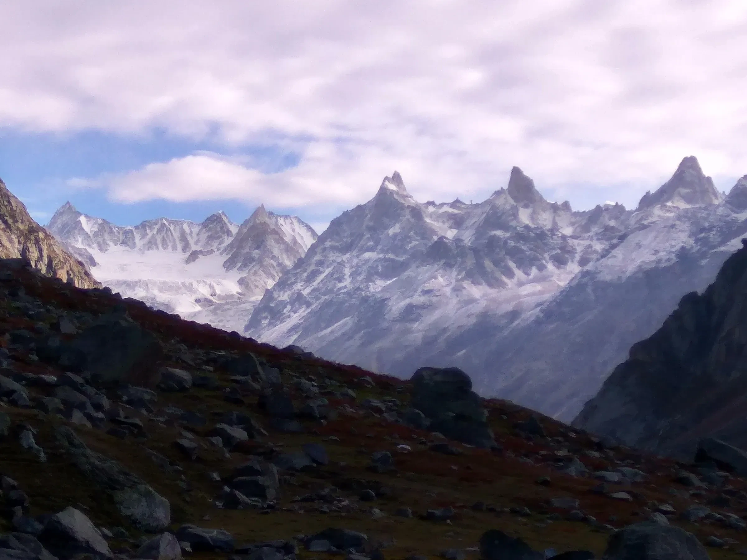 Jagged, snow-dusted peaks seen from the Hampta Pass trail