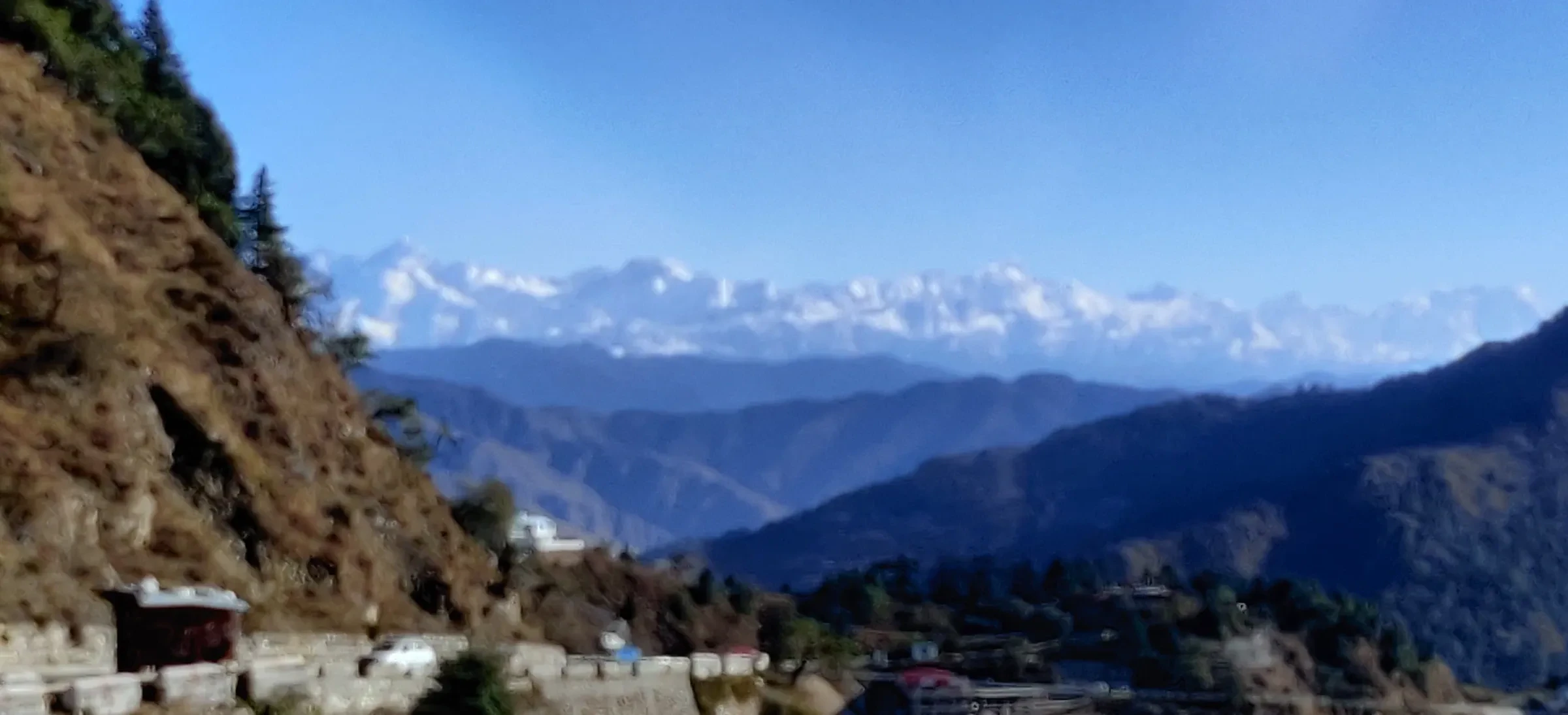 The Himalayan range seen from a mountain road above Mussoorie