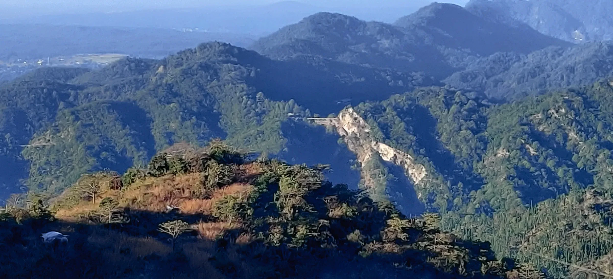 Forested hills and a valley seen from the Dehradun to Mussoorie road