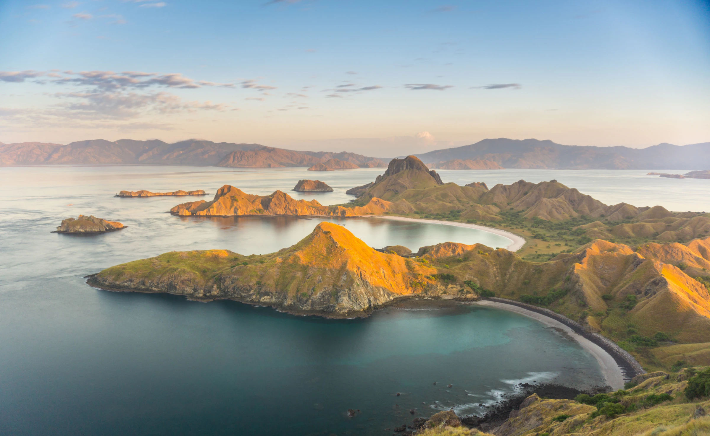 Padar island seen from above, with its curved bays and pale beaches