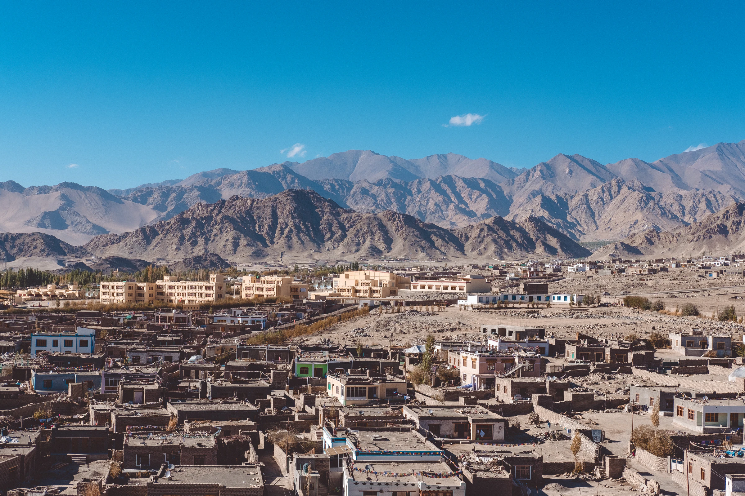 A building in Leh under the mountains on arrival