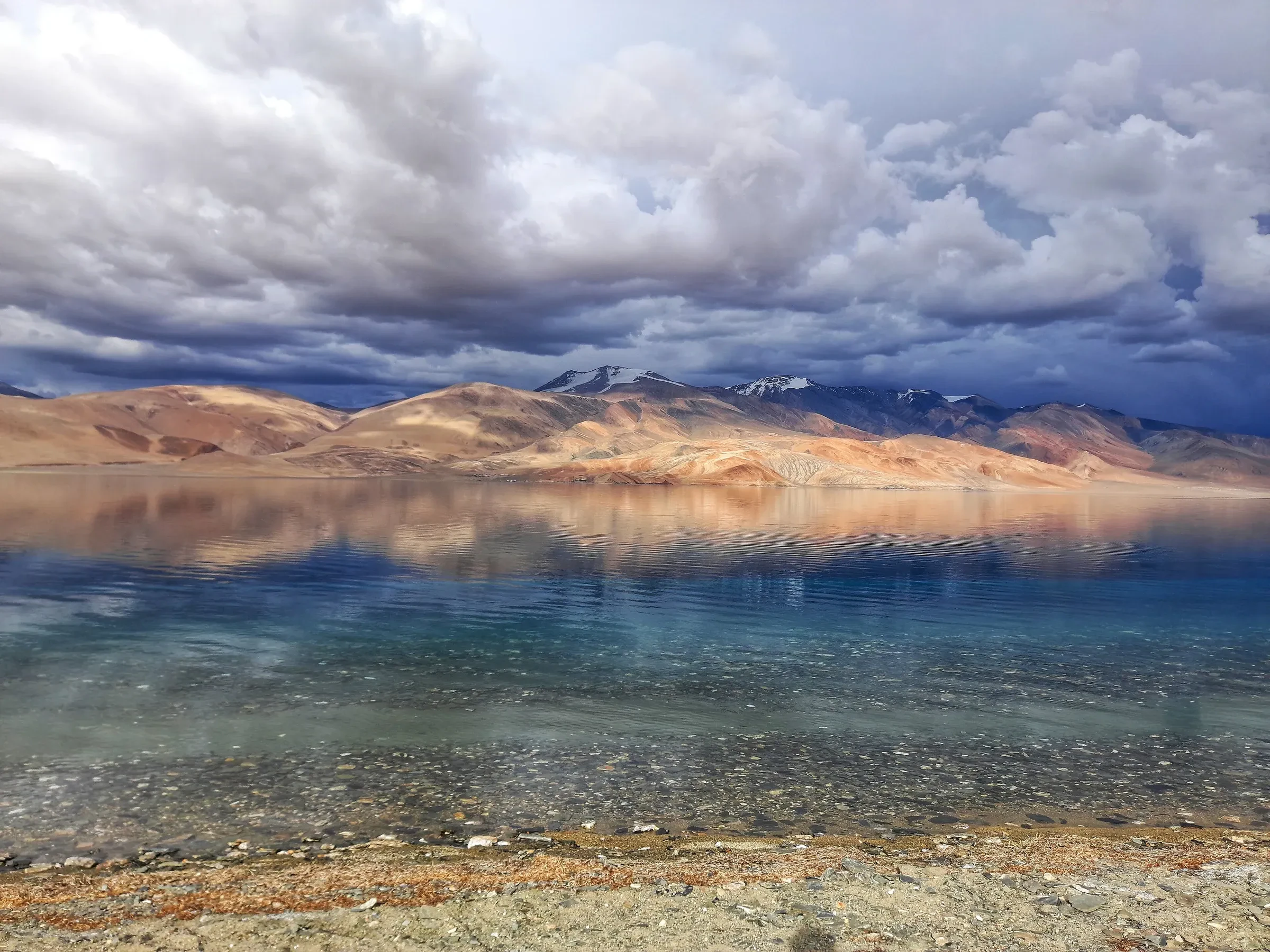 Clear water and stormy clouds over Tso Moriri in Ladakh