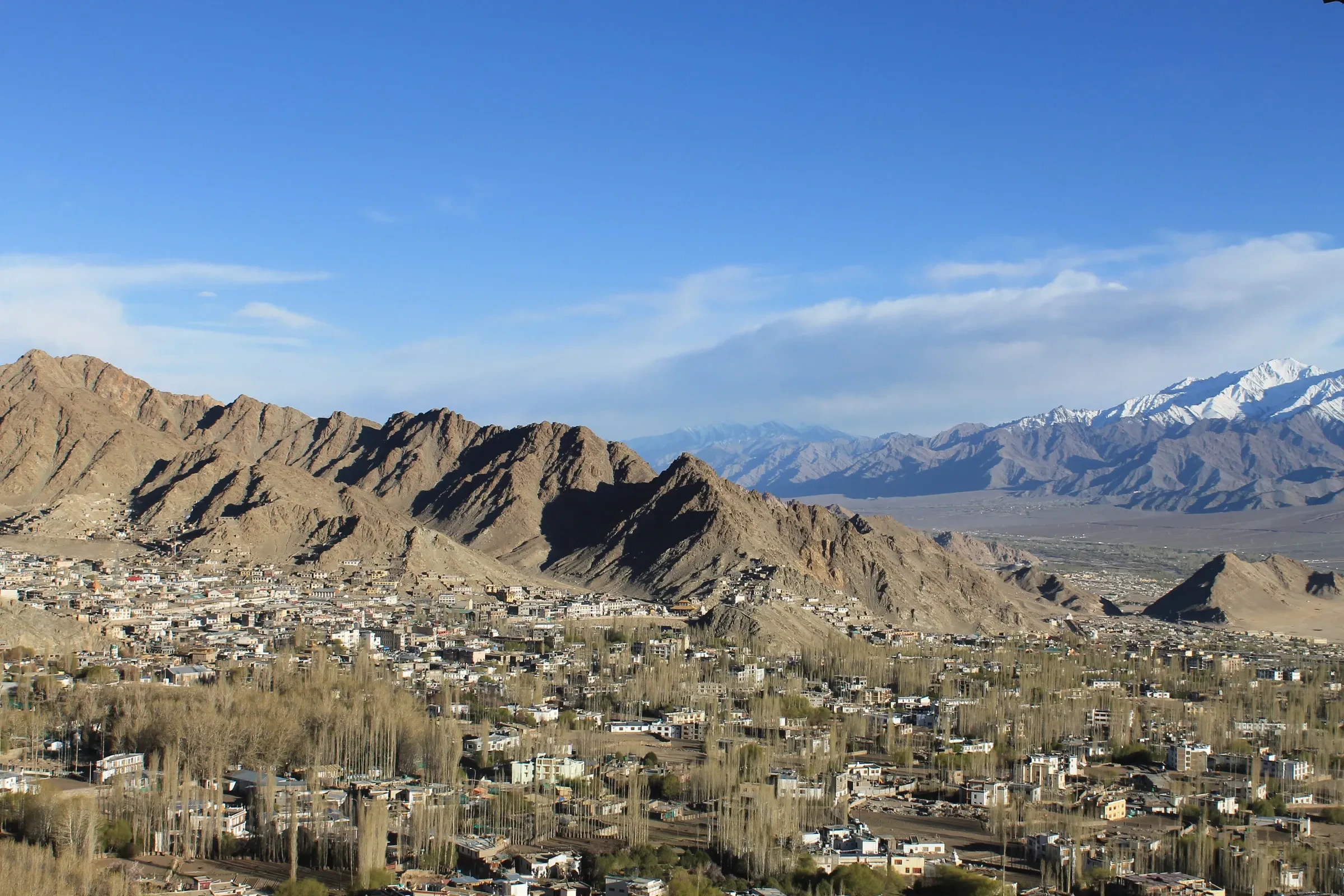 Leh town in the valley below the Ladakh mountains, seen from Shanti Stupa