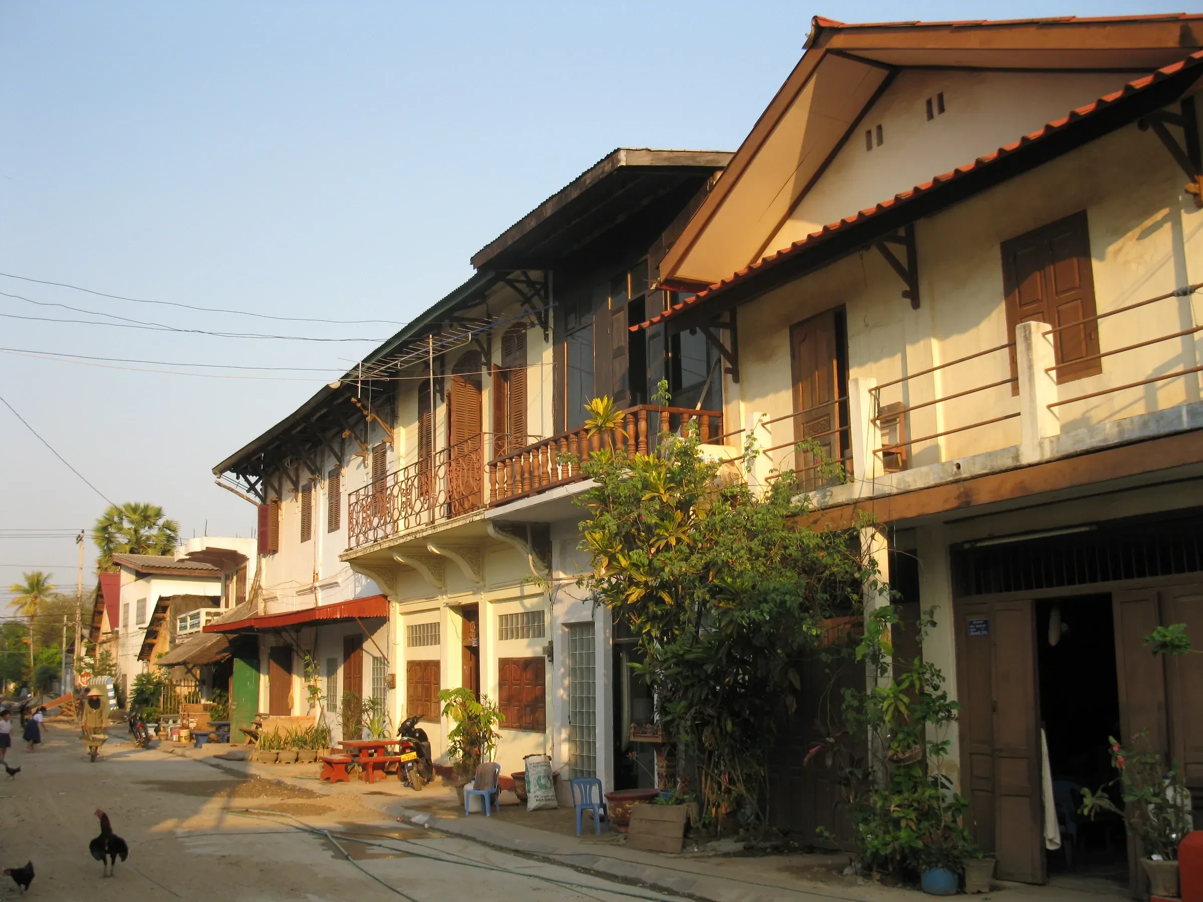 Old colonial shophouses along a street in Thakhek