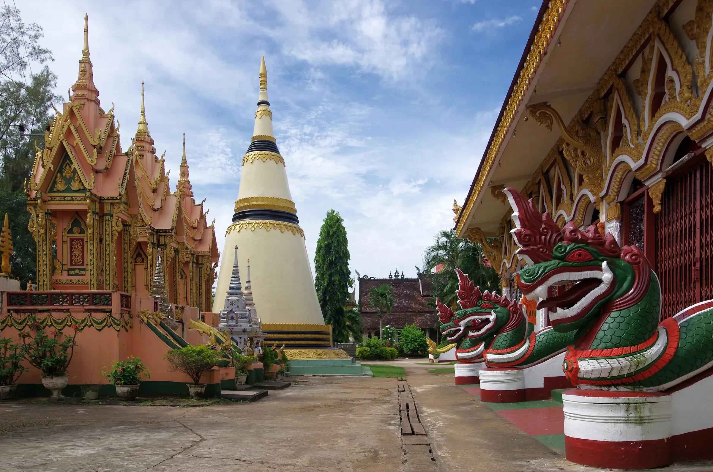 The chedi and naga statues at Wat Luang in Pakse