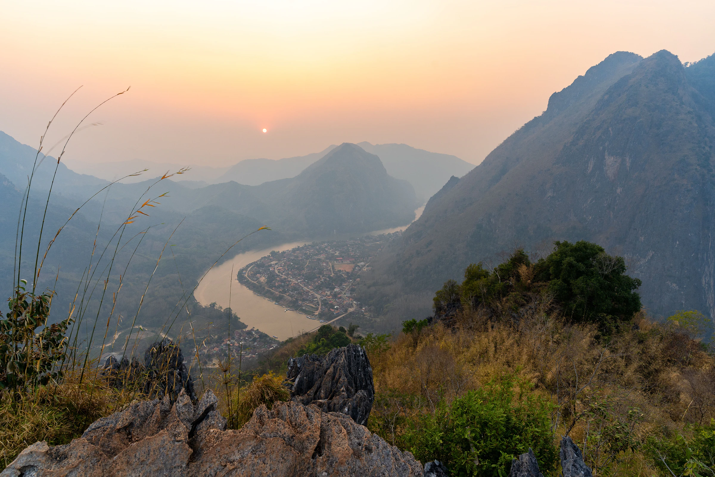 Nong Khiaw village and the Nam Ou river seen from Phadeng viewpoint at sunset