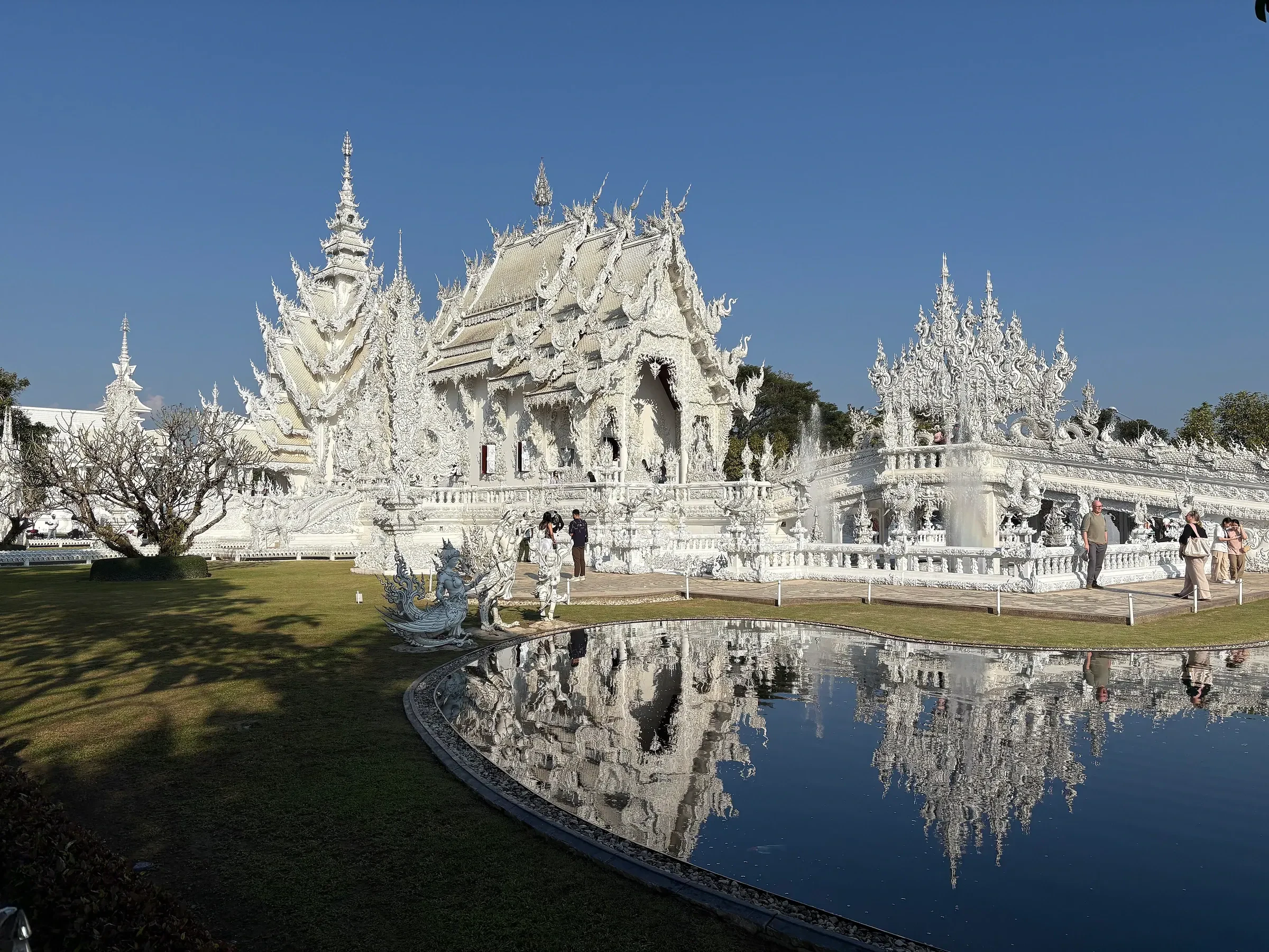 The White Temple, Wat Rong Khun, and its reflection in Chiang Rai