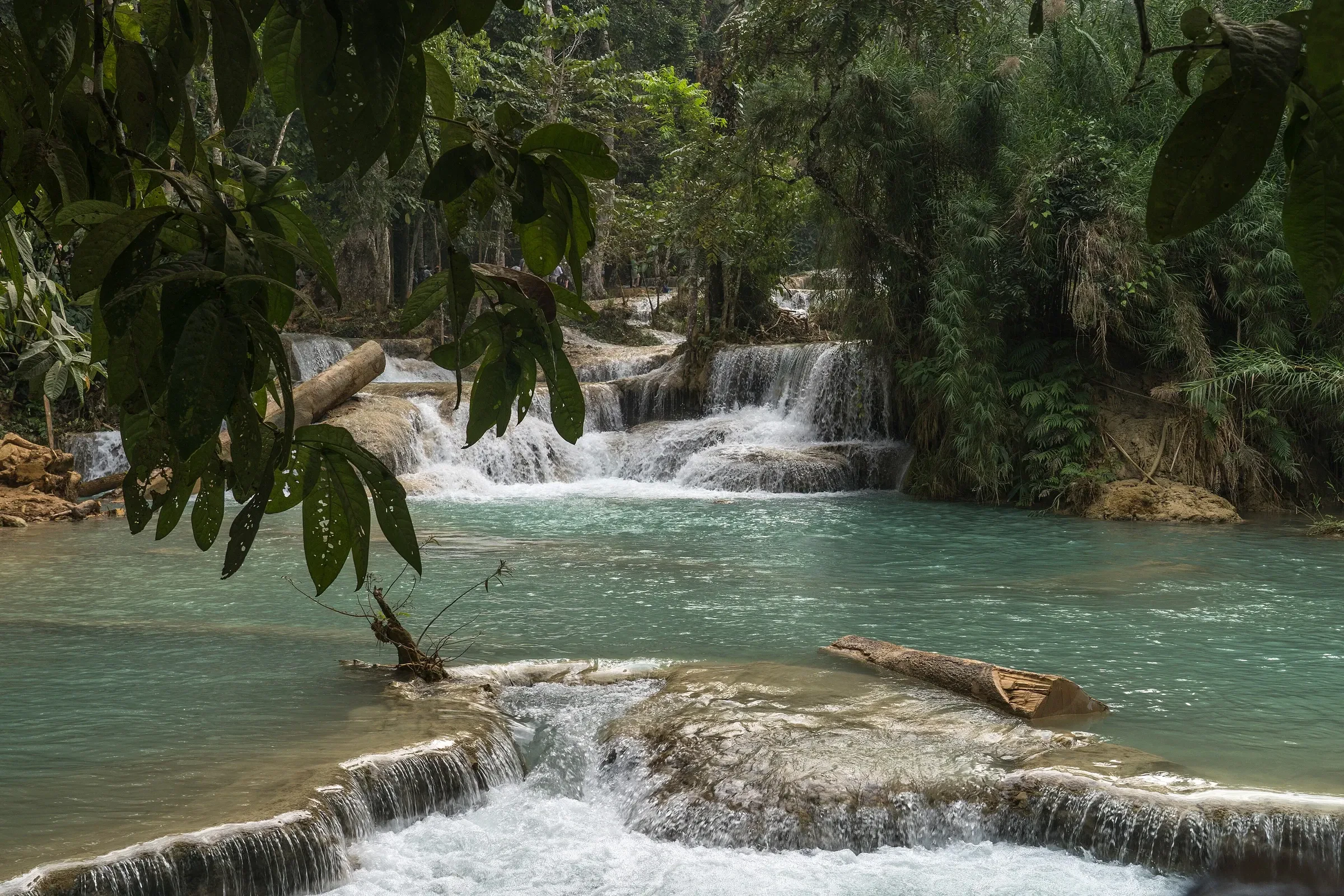 Water cascading through the forest at Kuang Si Falls near Luang Prabang