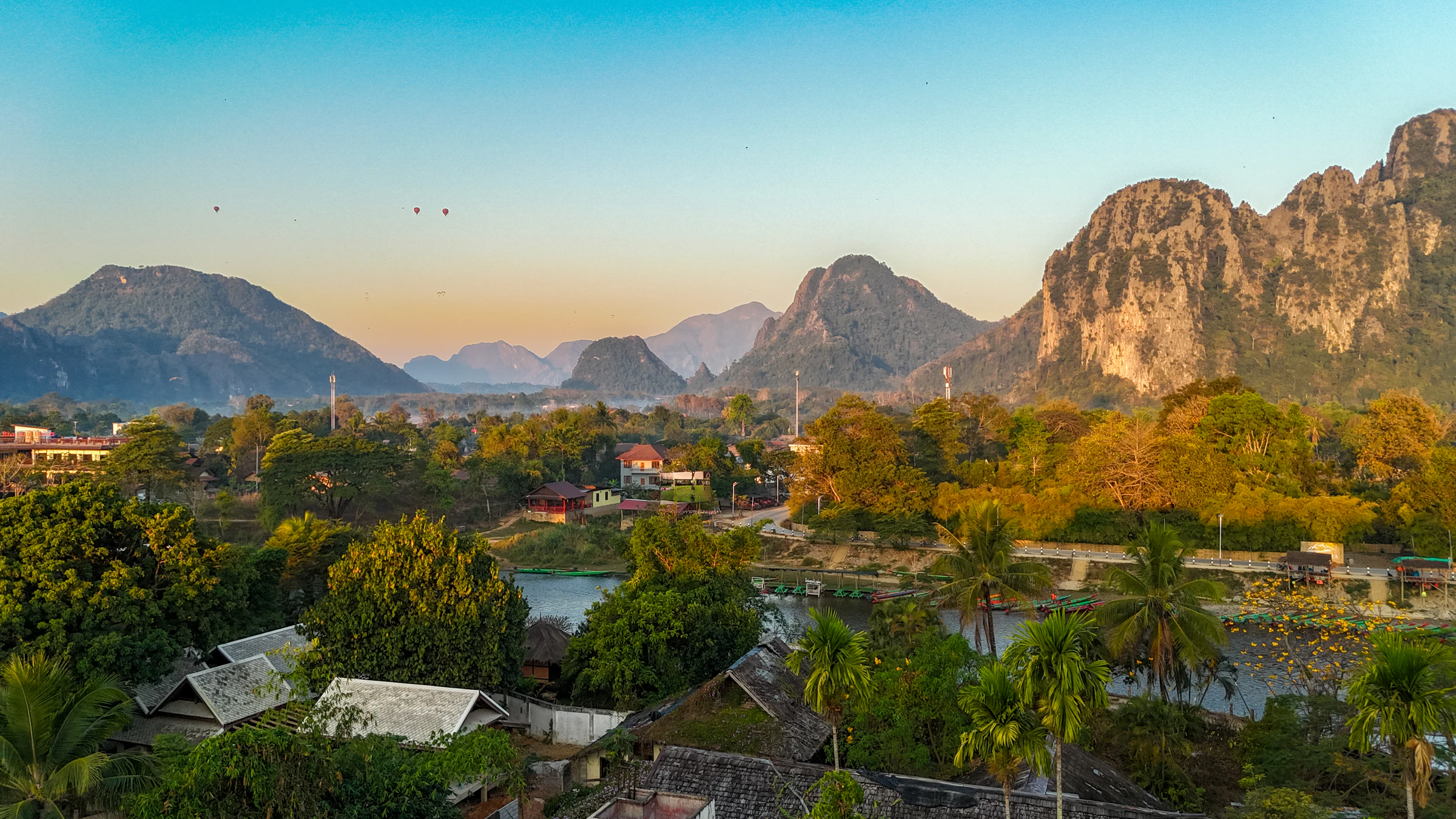 Limestone cliffs above Vang Vieng glowing at sunset