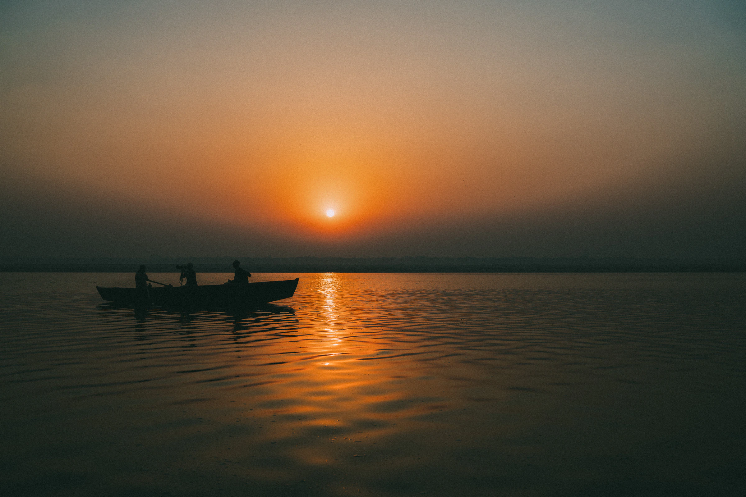 A rowing boat on the Ganges at sunrise