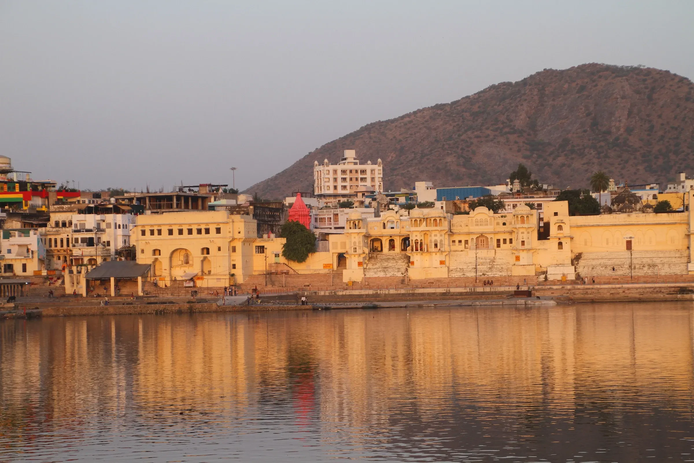 Warm evening light on the ghats and hills around Pushkar Lake