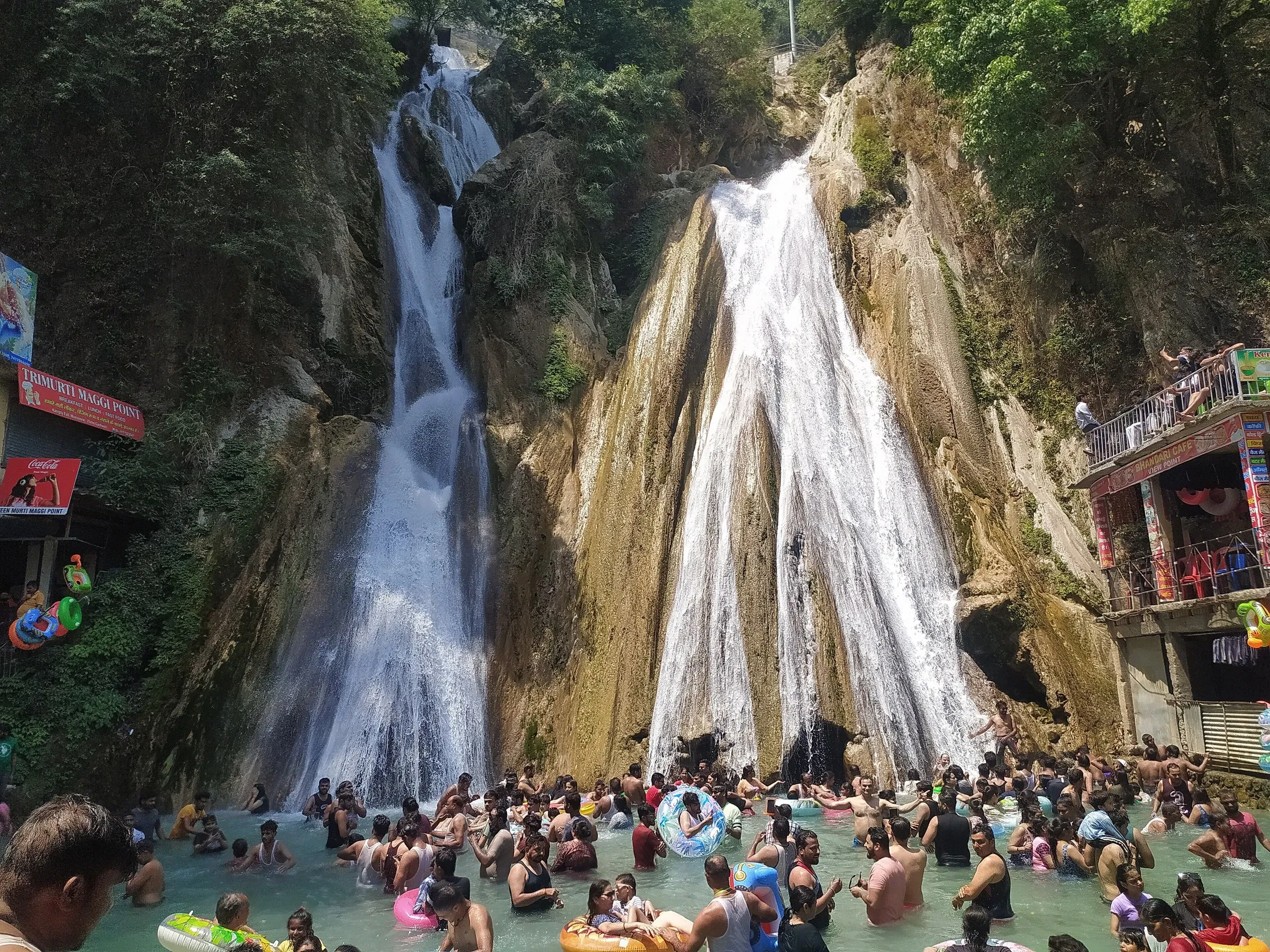 Kempty Falls near Mussoorie, with visitors bathing in the pool below