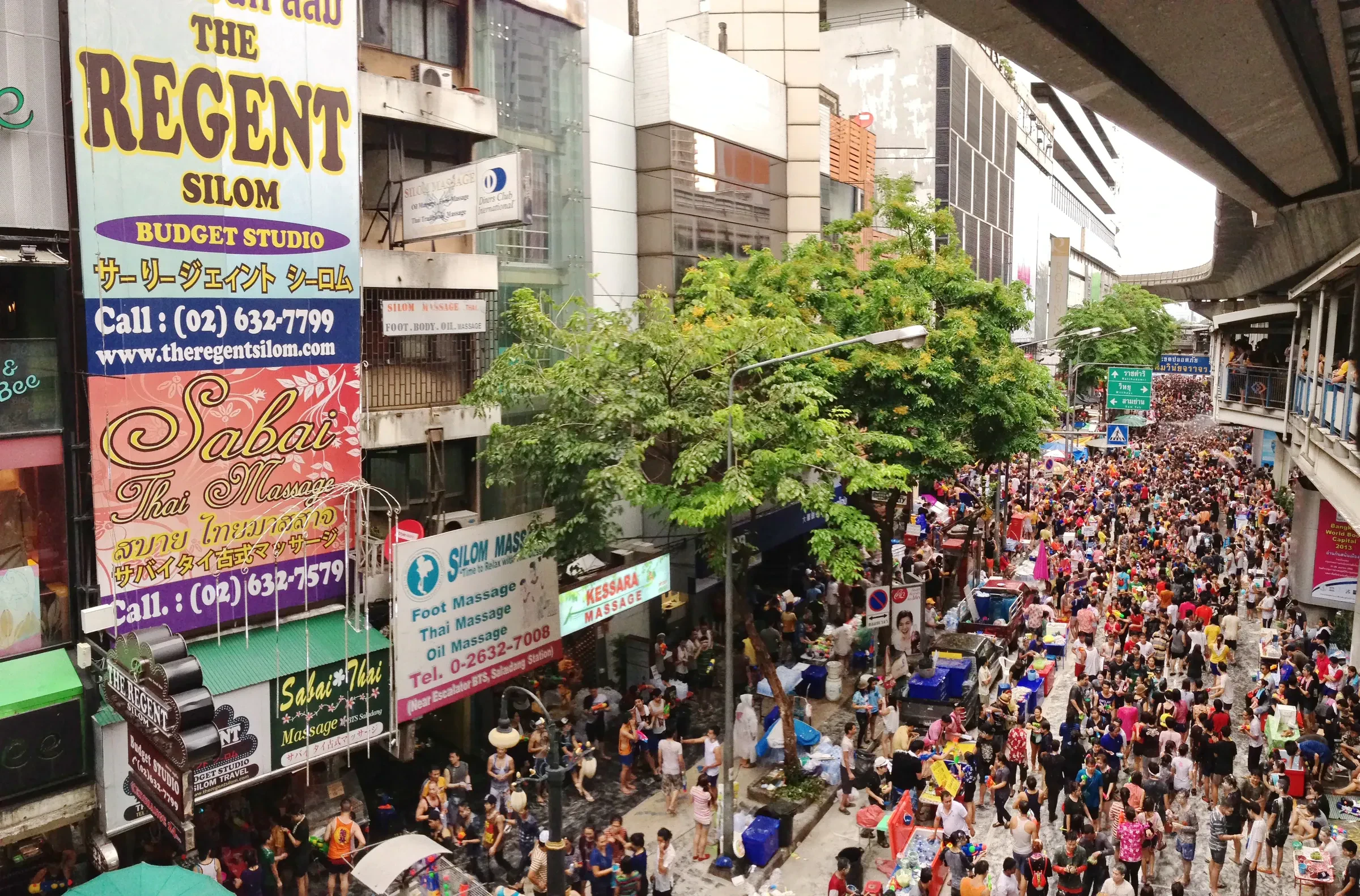 A packed Silom Road in Bangkok full of people in a Songkran water fight