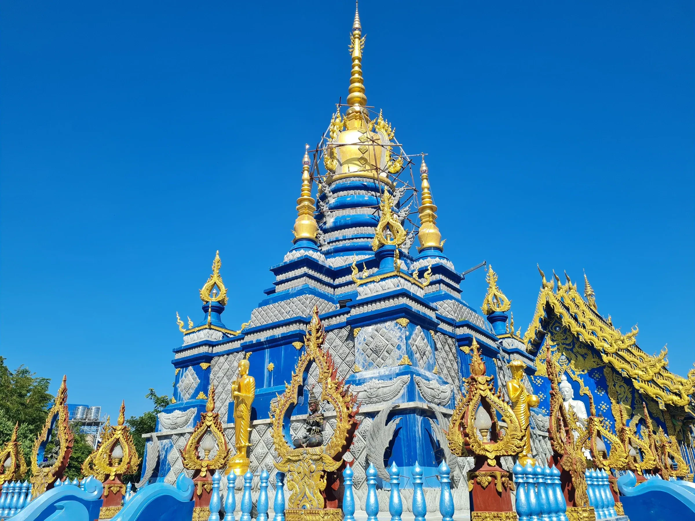 The blue and gold chedi of the Blue Temple, Wat Rong Suea Ten, in Chiang Rai