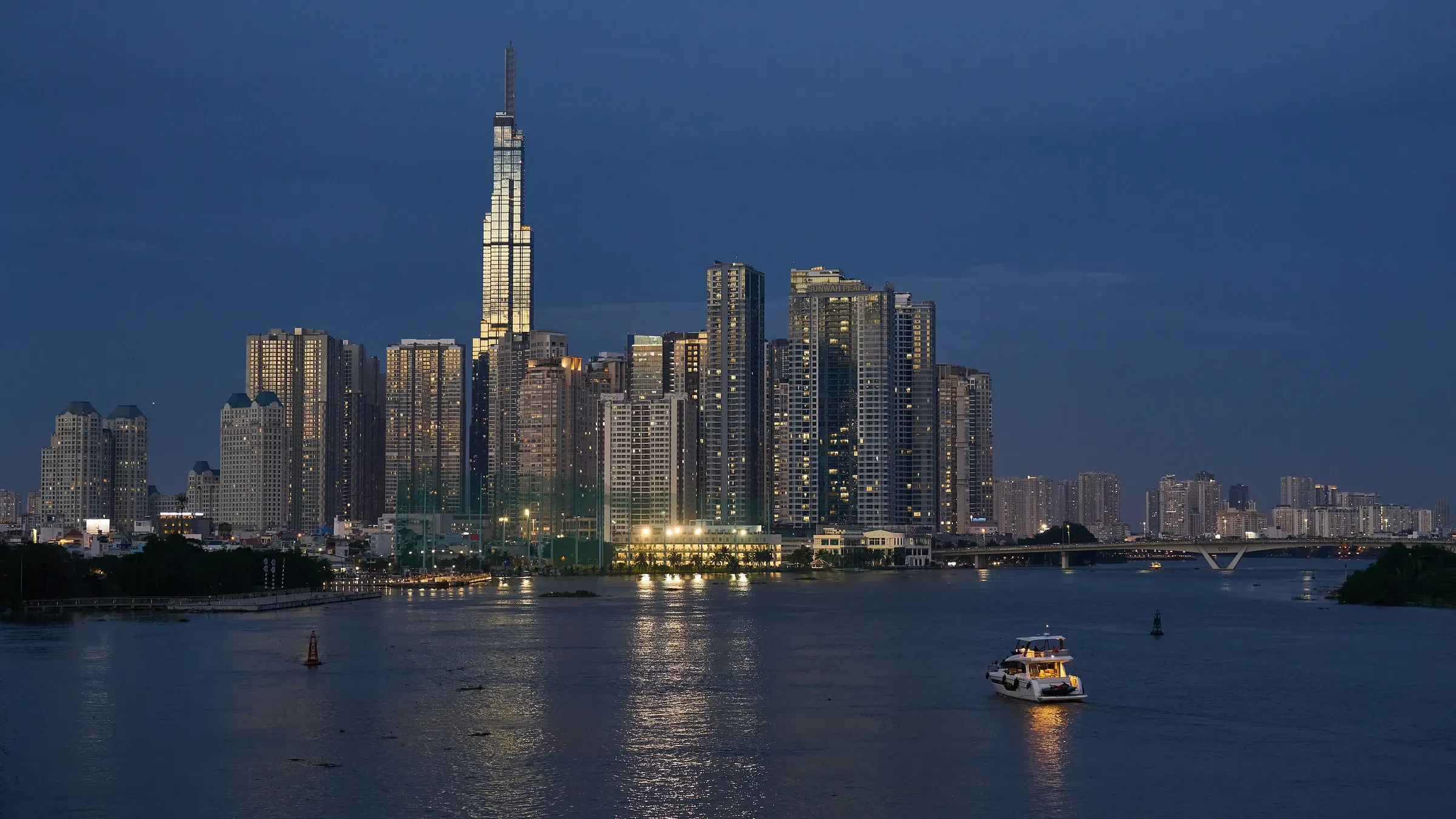 The Ho Chi Minh City skyline across the Saigon River at blue hour