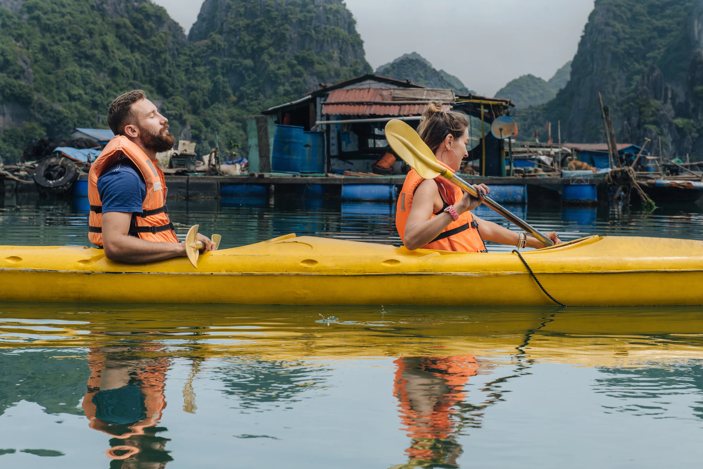 A kayak among the limestone islands of Lan Ha Bay