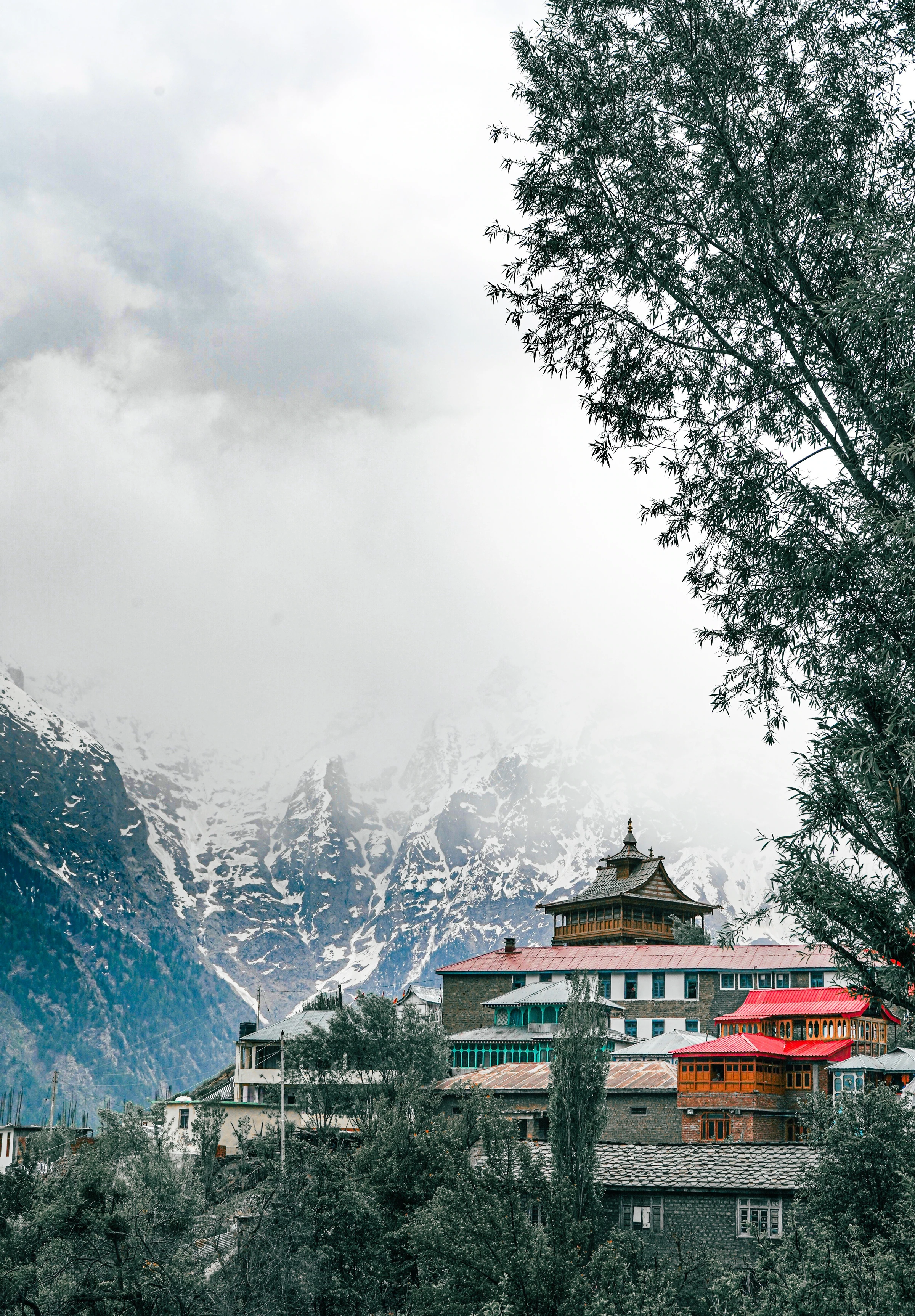 Lochawa La Khang monastery in Kalpa with the snow peaks of the Kinner Kailash range behind