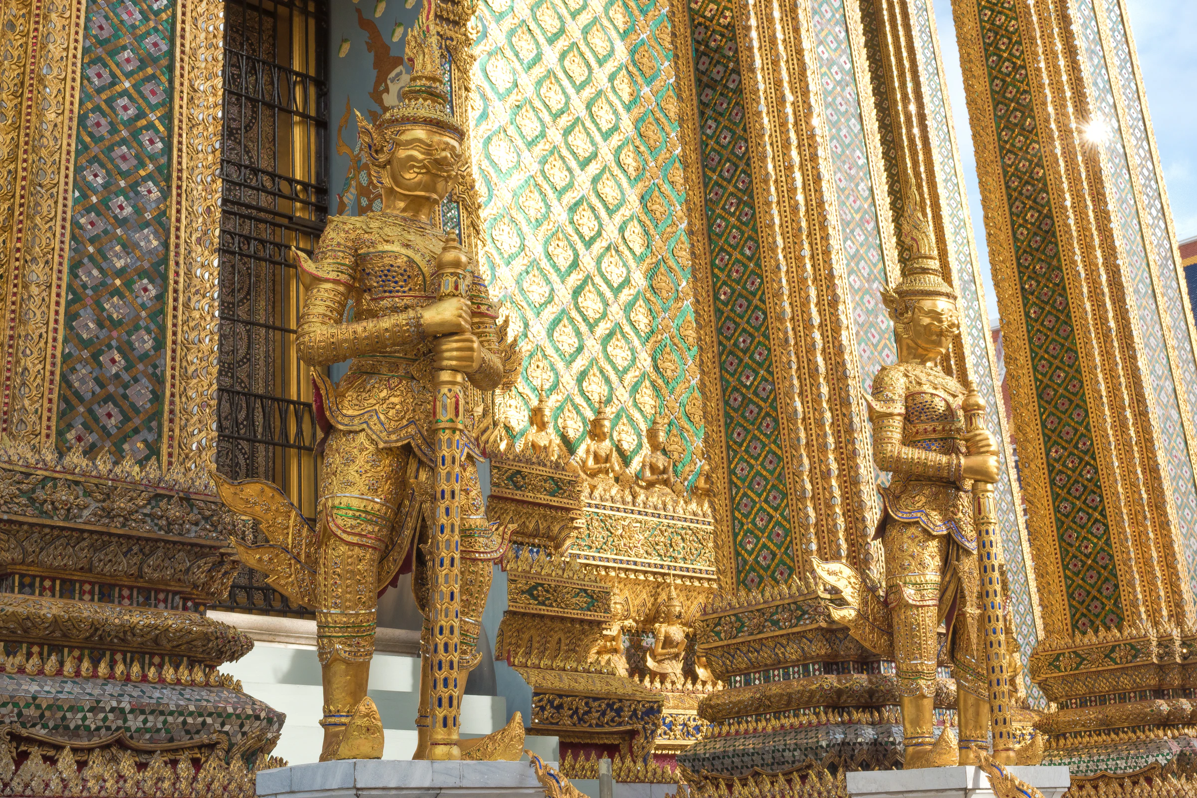 Gold guardian statues at the Grand Palace in Bangkok
