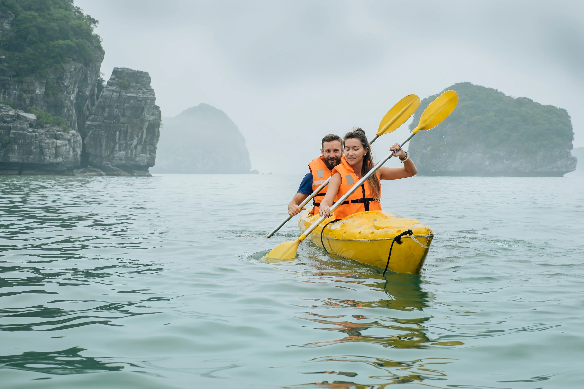 A kayak on foggy water in Lan Ha Bay