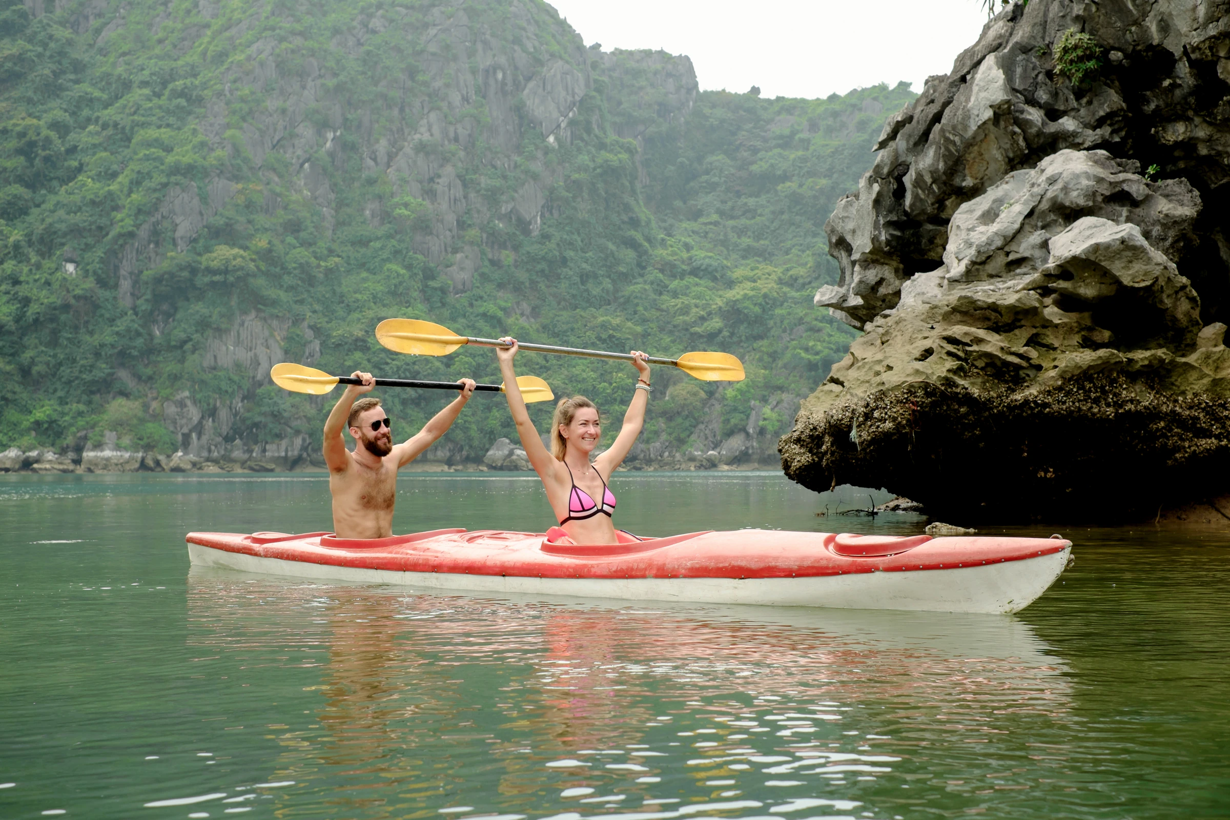 A kayak on the water among Lan Ha Bay's limestone karsts