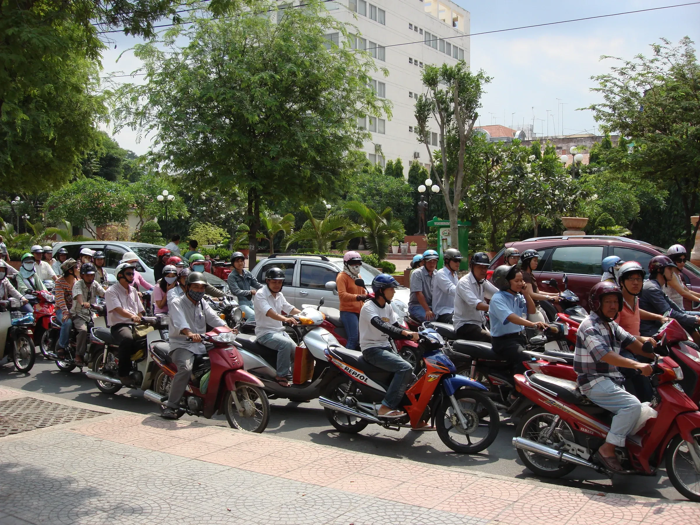 Motorbike riders waiting at a junction in Ho Chi Minh City